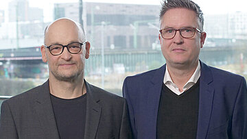 Abbildung des Zertifikatsleiters Prof. Dr. Olaf Zeitnitz und des SPIEGEL-Experten Tim Bartz. Der Klick führt zum Kurs.